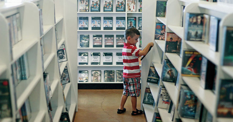 picture of a boy in the video store