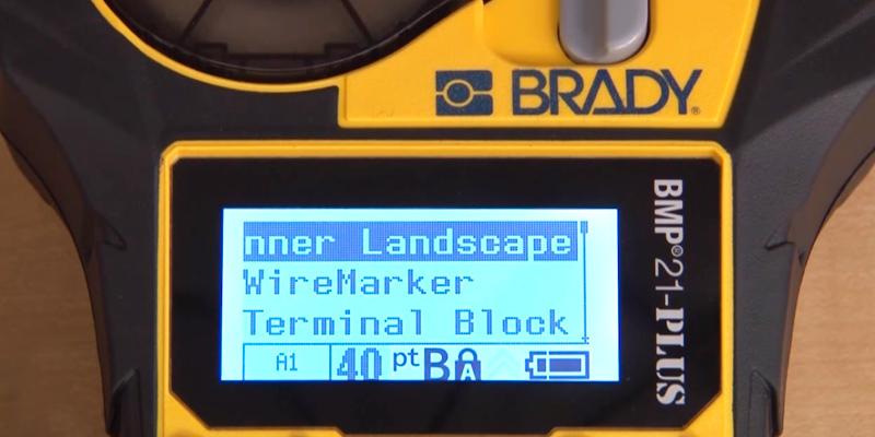 Brady BMP21-PLUS Handheld Label Maker in the use - Bestadvisor