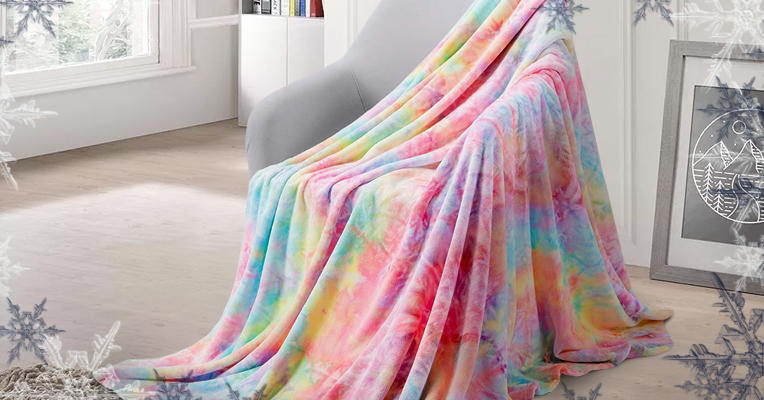 A rainbow throw blanket cascaded over a chair